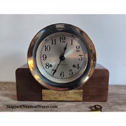 A Commemorative Seth Thomas Brass Ship's Bell Clock With Mahogany Base